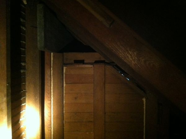 Air leakage through tongue and groove paneling in a built in cabinet of the Maurice Knight home