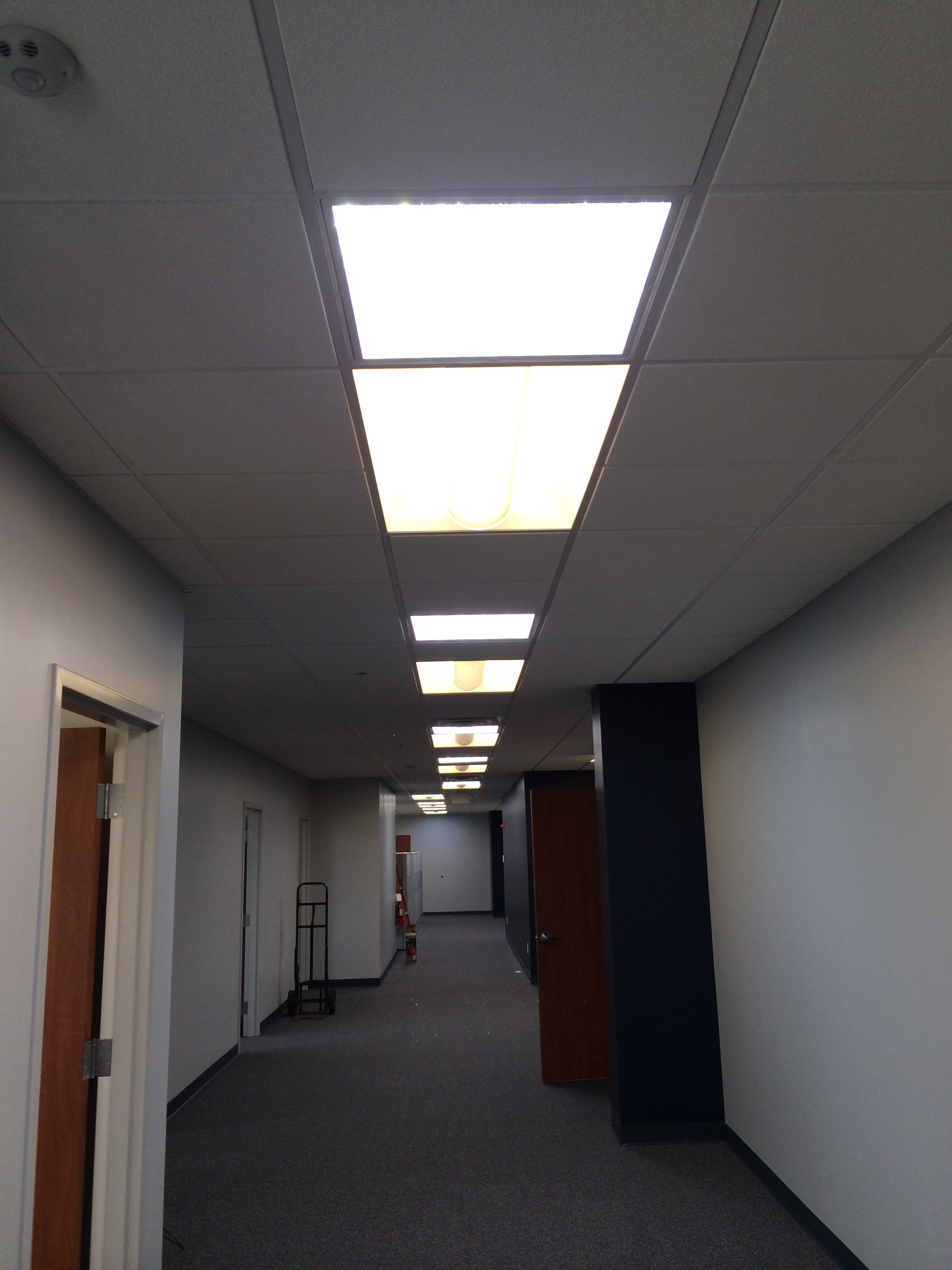 Office hallway, the first light is skylight, then a flourescent light fixture