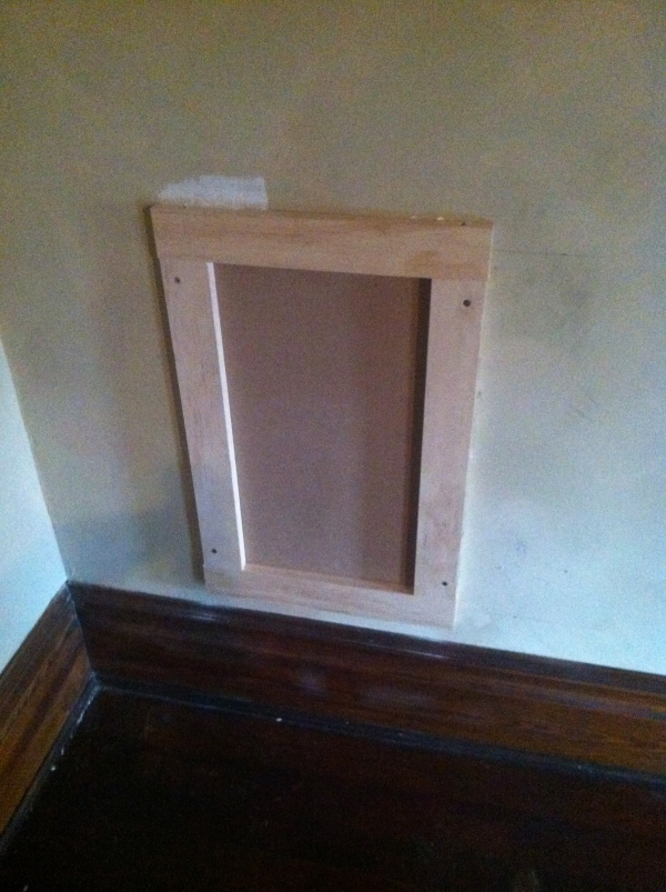 a wall hatch in the maurice knight home with trim matched to the rest of the floor