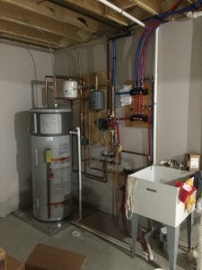 Heat pump water heater in the basement of the Hiram College TREE House Deep Energy Retrofit project