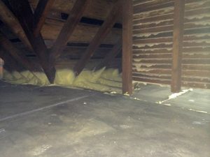 Hiram College TREE House attic after air sealing with foam board and spray foam