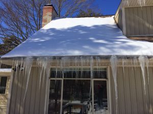 Substantial ice damming and icicle problem in the rear of this home. There is a knee wall attic above here that needed to be fixed.